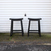 Two Black Wooden Stools