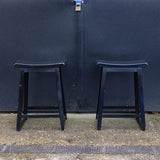 Two Black Wooden Stools