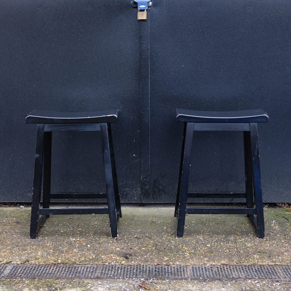 Two Black Wooden Stools